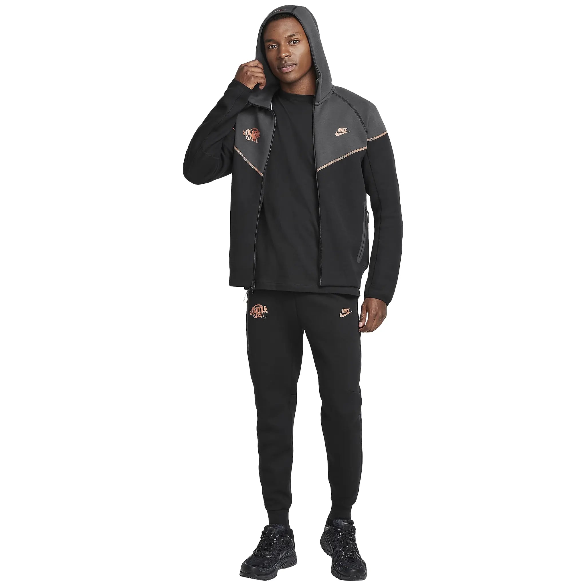 Model full view of Syna World x Nike Central Cee Tech Fleece Black Tracksuit HQ3748-010 | HQ3749-010